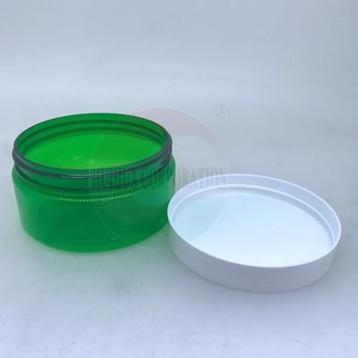 Le pot en plastique vide d'ANIMAL FAMILIER avec le corps/crème verts cogne l'emballage cosmétique
